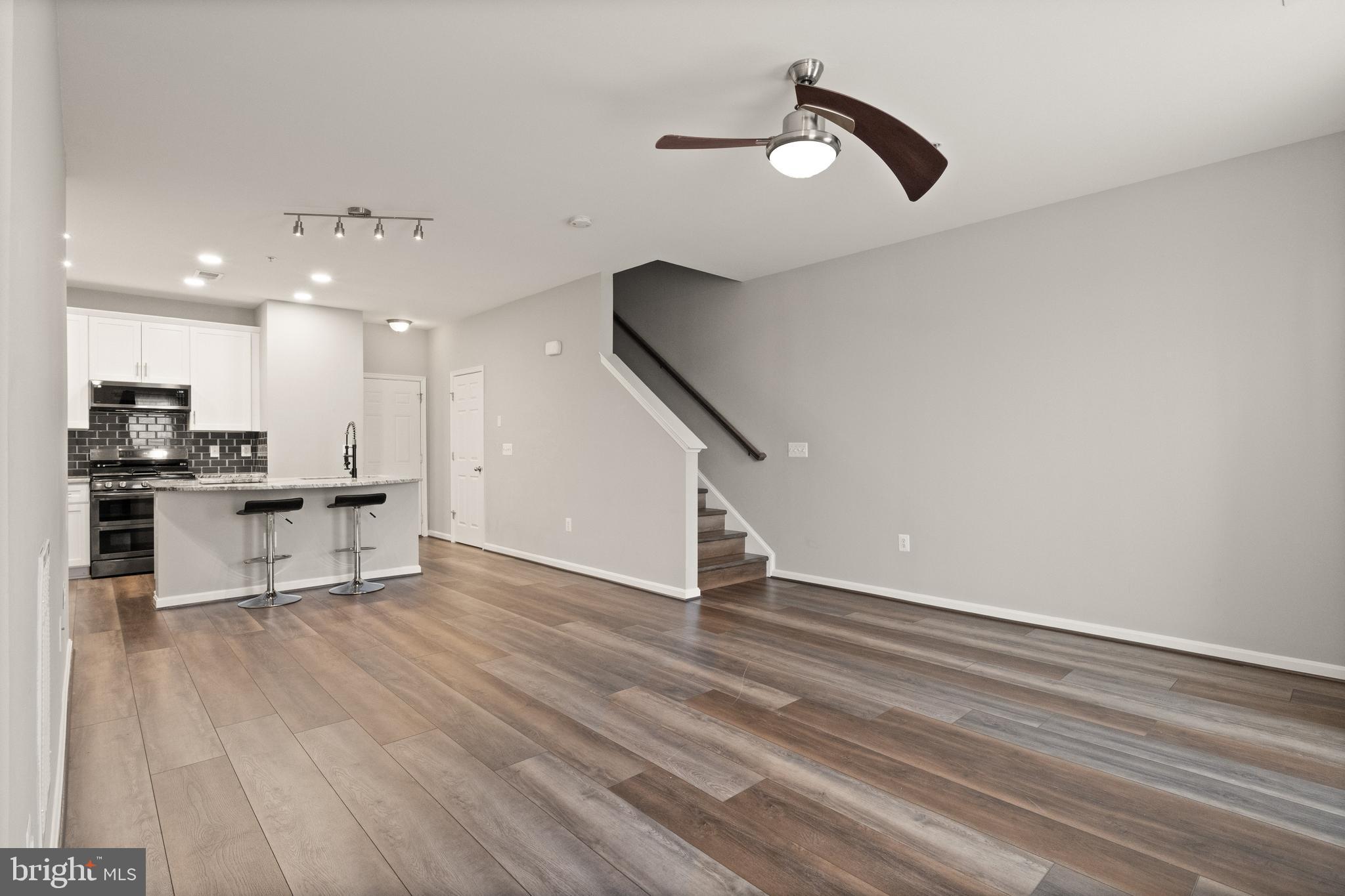 9541 Center Street Manassas, VA 20110 - Photo 7 of 41 a view of kitchen with cabinets and wooden floor