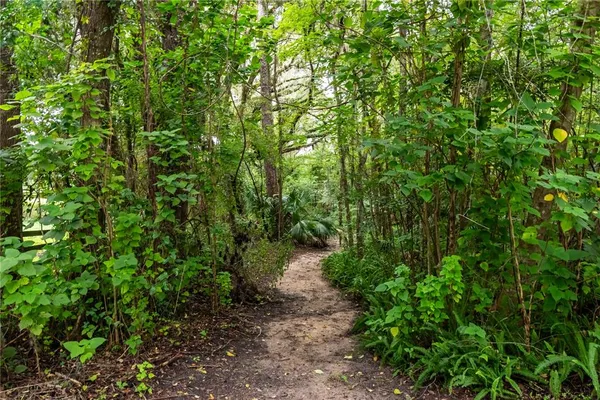 an aerial view of house with yard and outdoor seating