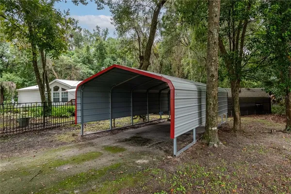 an empty room with windows and outdoor view