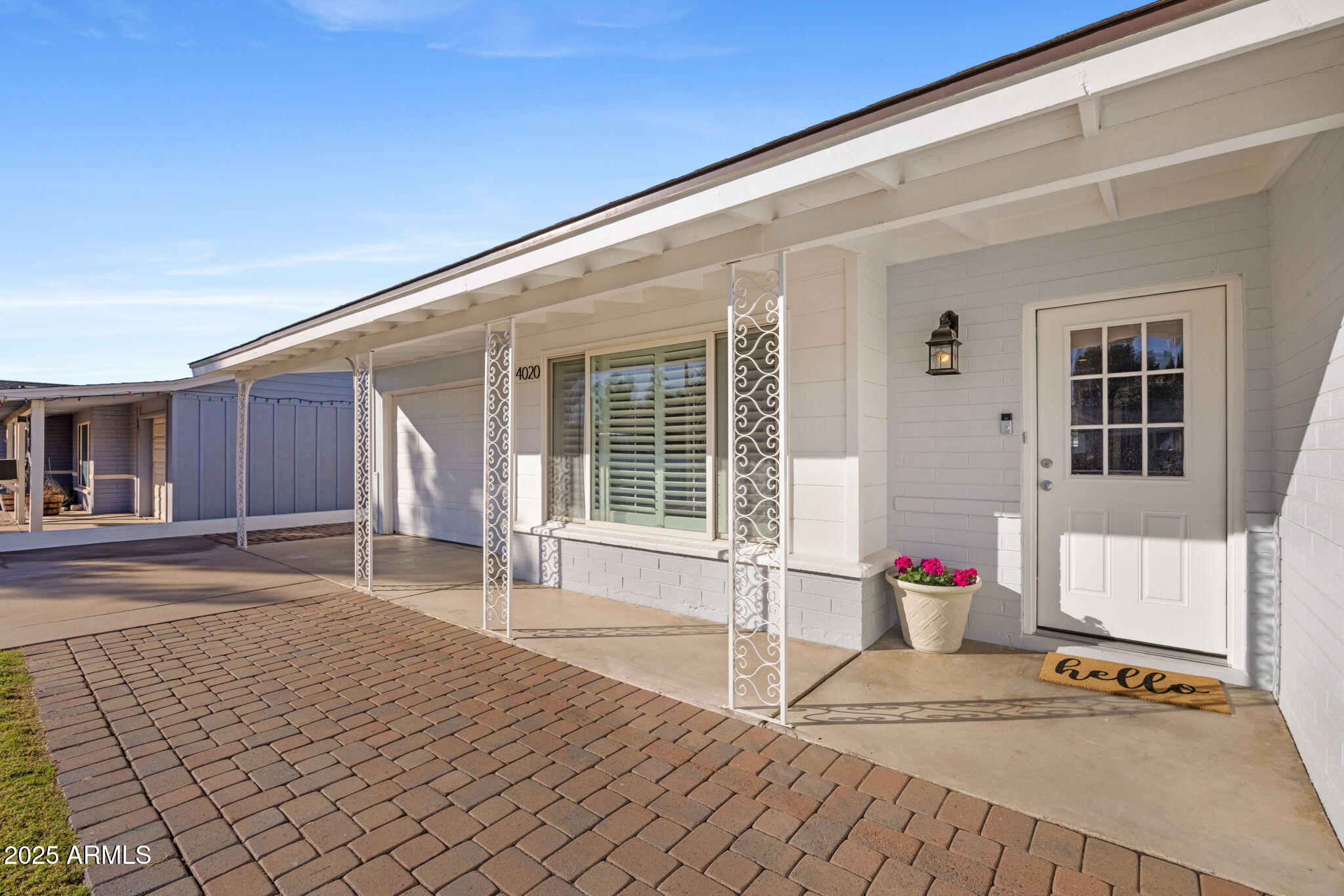 4020 North 44th Place Phoenix, AZ 85018 - Photo 2 of 17 a front view of a house with a basket ball court and chair