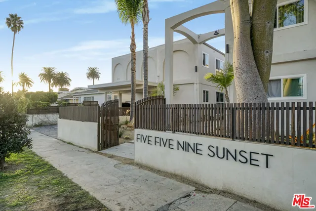 a view of a street with a building in the background