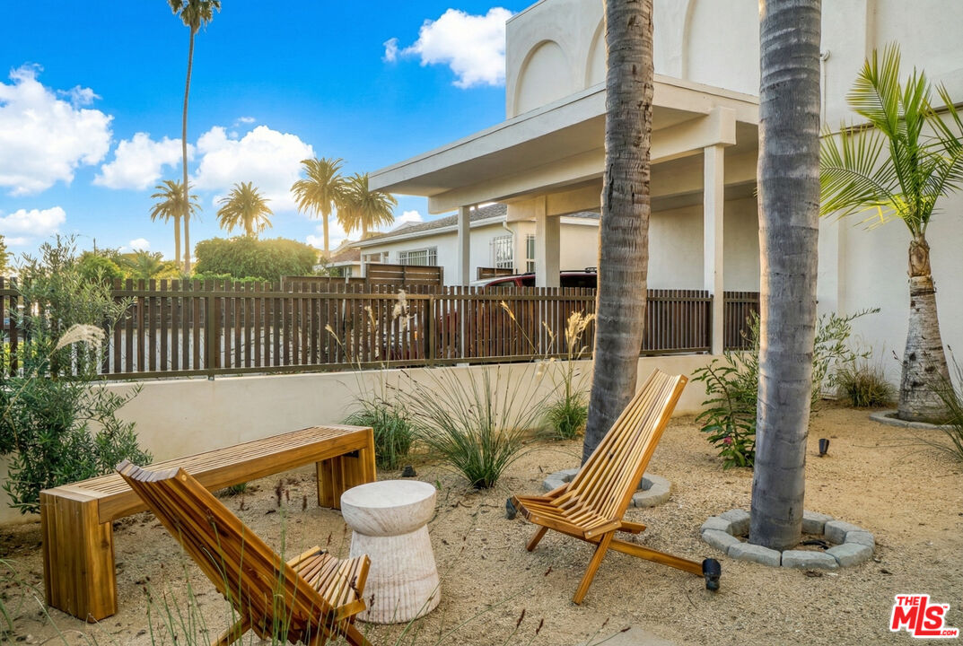 559 Sunset Avenue Venice, CA 90291 - Photo 3 of 16 a view of a balcony with table and chairs