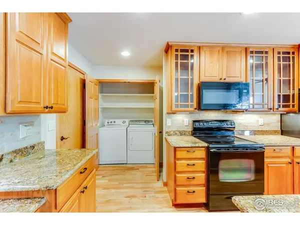 a kitchen with a stove a sink and a microwave