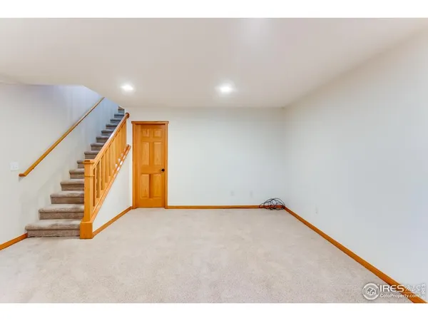 a view of an empty room with stairs
