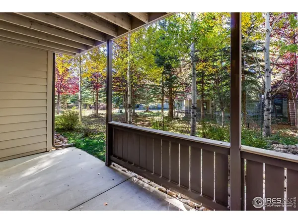 a view of balcony with wooden floor