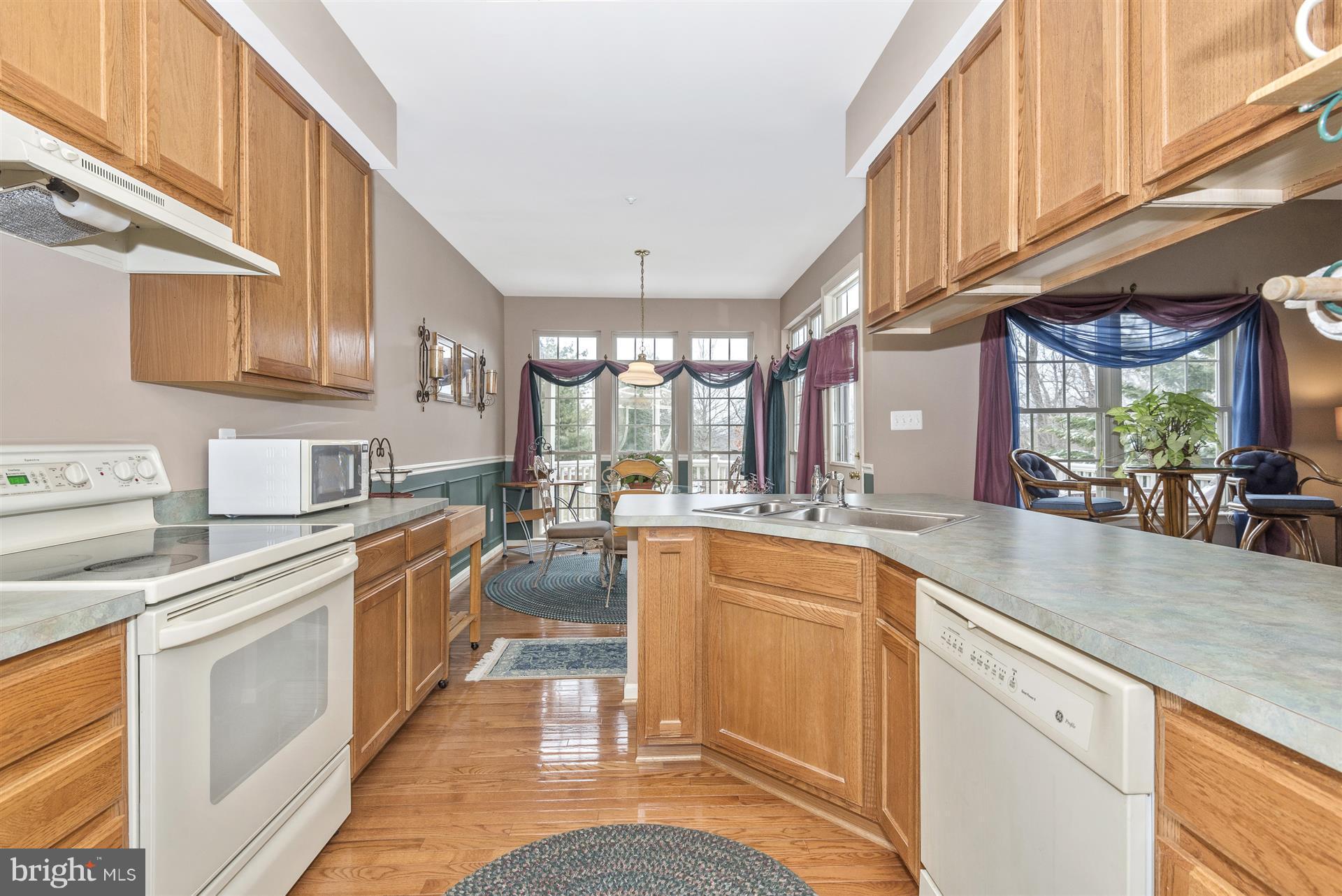 2400 Rippling Brook Road Frederick, MD 21701 - Photo 8 of 30 Kitchen has oak cabinets and hardwood flooring