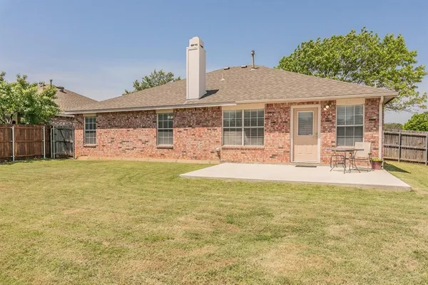 a view of a house with pool and chairs