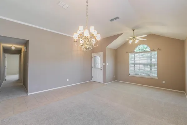 a view of a chandelier in big room and chandelier