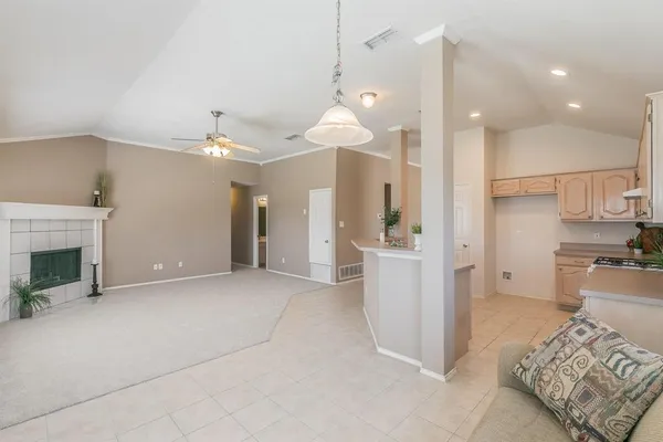 a view of a kitchen with furniture and a fireplace