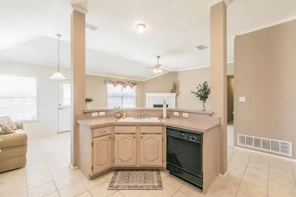 a kitchen with a sink stove and cabinets