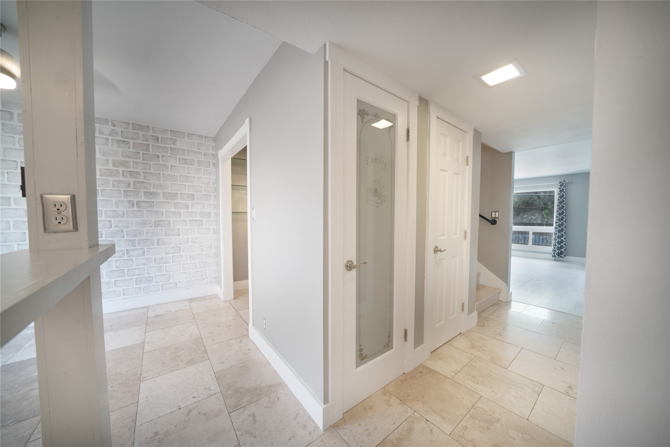 500 East Riverside Drive, Unit 242 Austin, TX 78704 - Photo 11 of 40 Hall with baseboards and brick wall