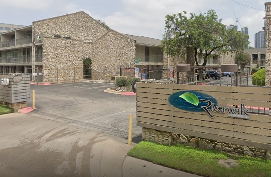 500 East Riverside Drive, Unit 242 Austin, TX 78704 - Photo 2 of 40 Community / neighborhood sign with fence and uncovered parking