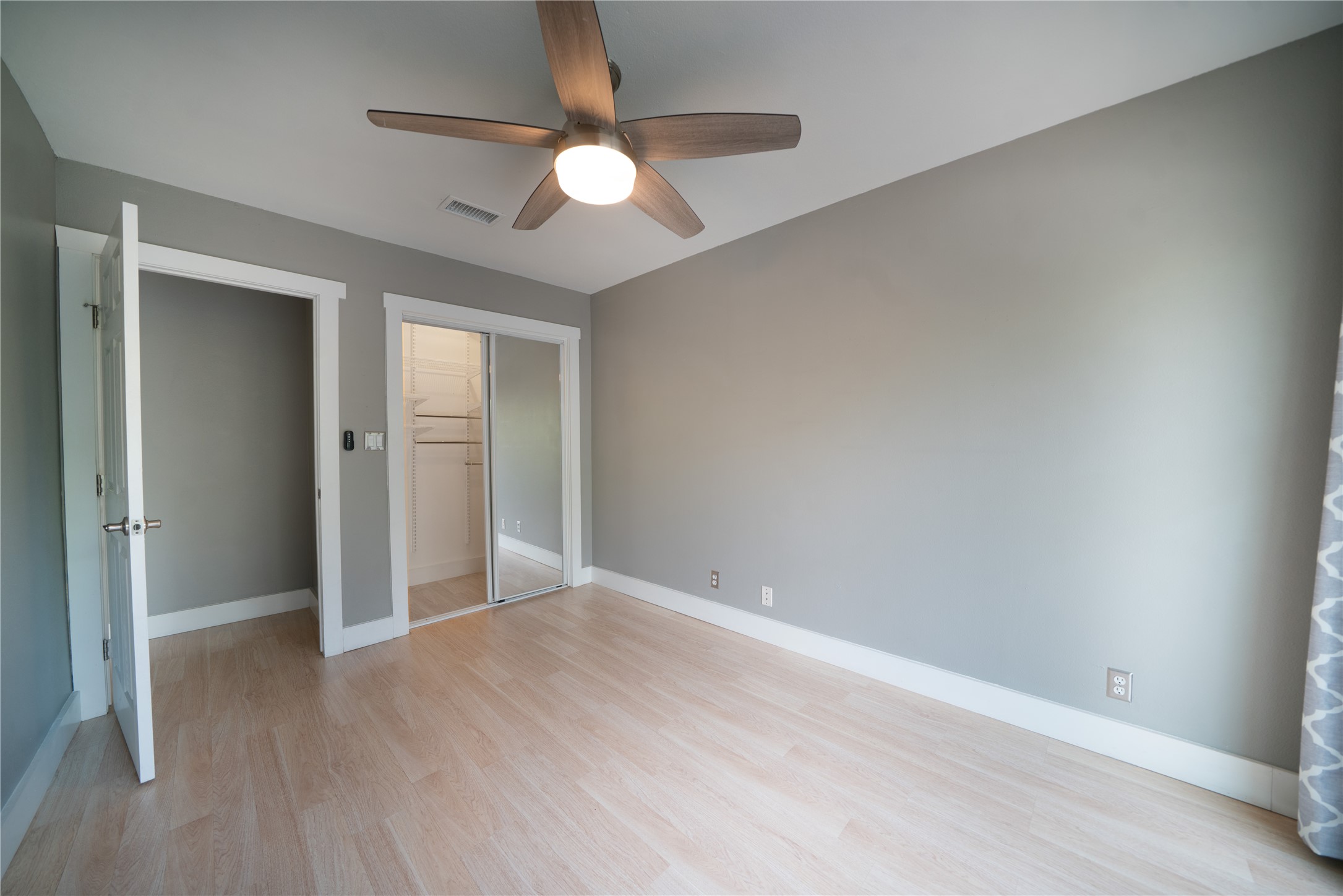 500 East Riverside Drive, Unit 242 Austin, TX 78704 - Photo 22 of 40 Unfurnished bedroom with light wood-type flooring, visible vents, and baseboards