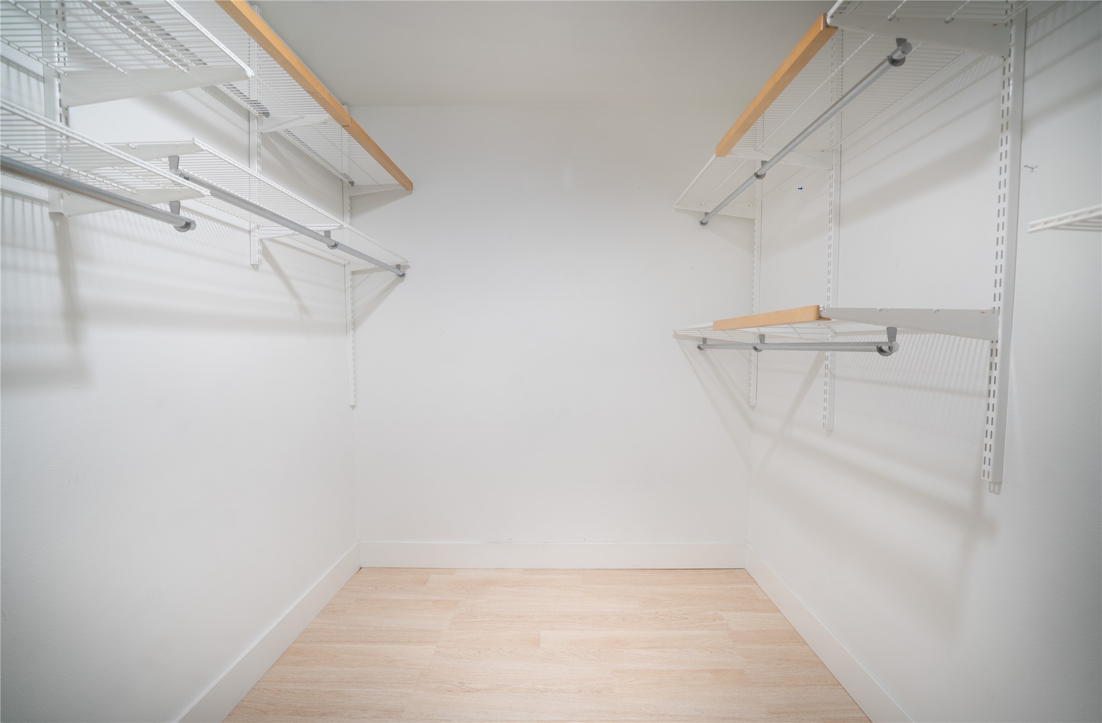 500 East Riverside Drive, Unit 242 Austin, TX 78704 - Photo 25 of 40 Spacious closet featuring wood finished floors