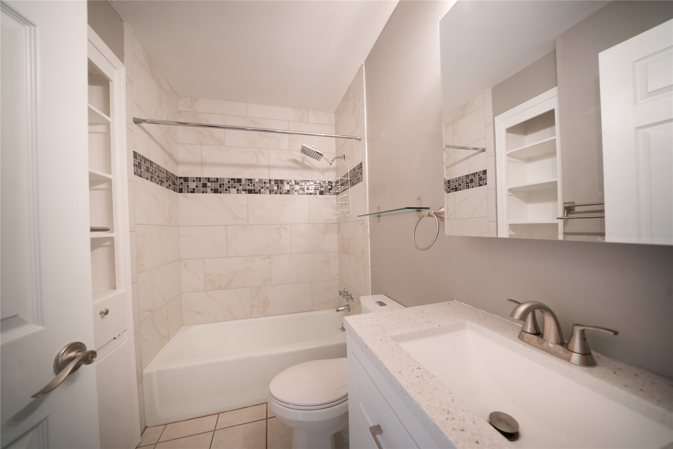 500 East Riverside Drive, Unit 242 Austin, TX 78704 - Photo 8 of 40 Full bath featuring tile patterned flooring, toilet, vanity, and shower combination