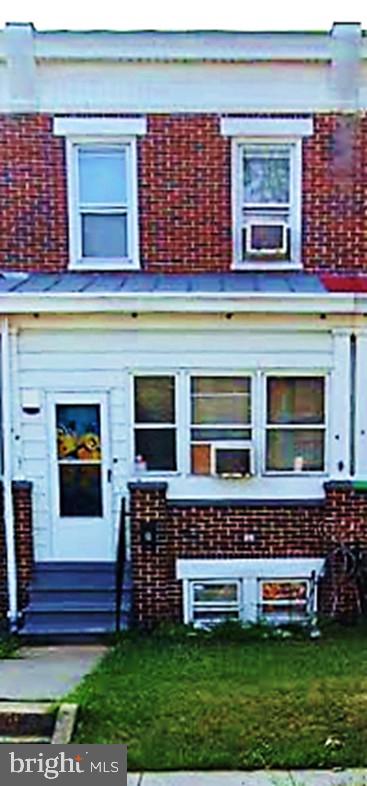 3715 3rd Street Baltimore, MD 21225 - Photo 1 of 1 a front view of a house with a yard
