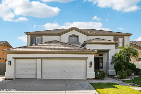 a kitchen with stainless steel appliances kitchen island granite countertop a sink and cabinets