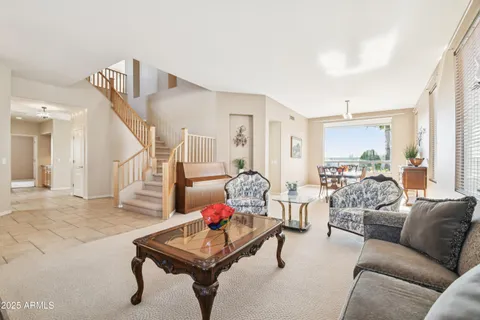 a kitchen with kitchen island a large window in it