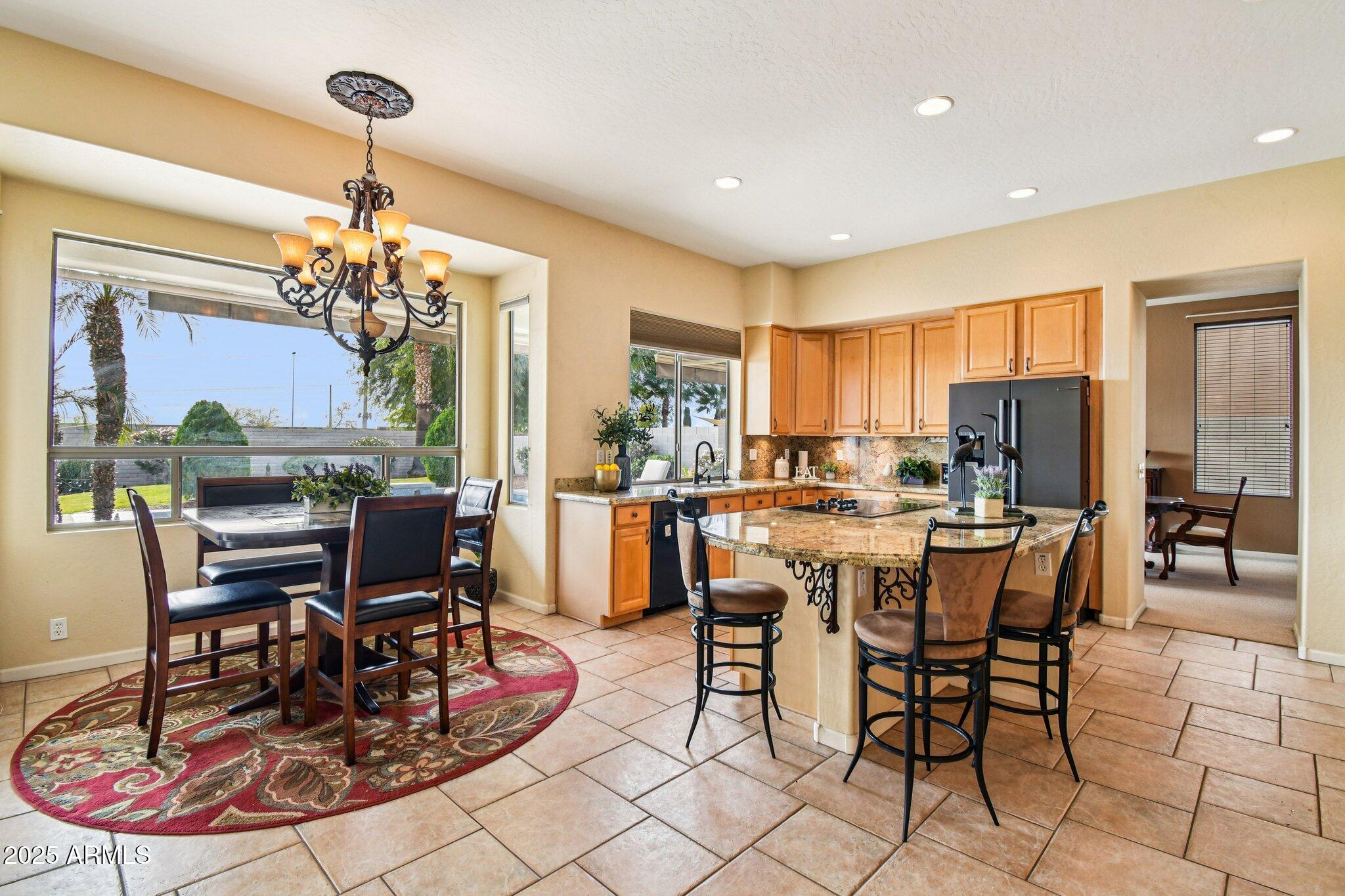 923 West Windsong Drive Phoenix, AZ 85045 - Photo 8 of 57 a view of a dining room with furniture