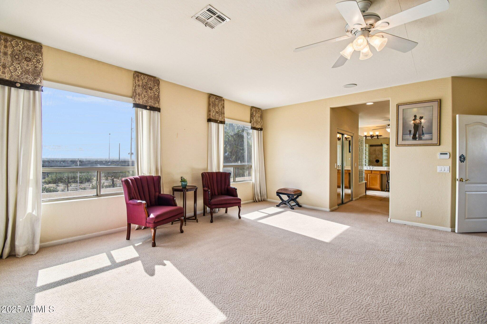 923 West Windsong Drive Phoenix, AZ 85045 - Photo 21 of 57 a living room with furniture ceiling fan and a window