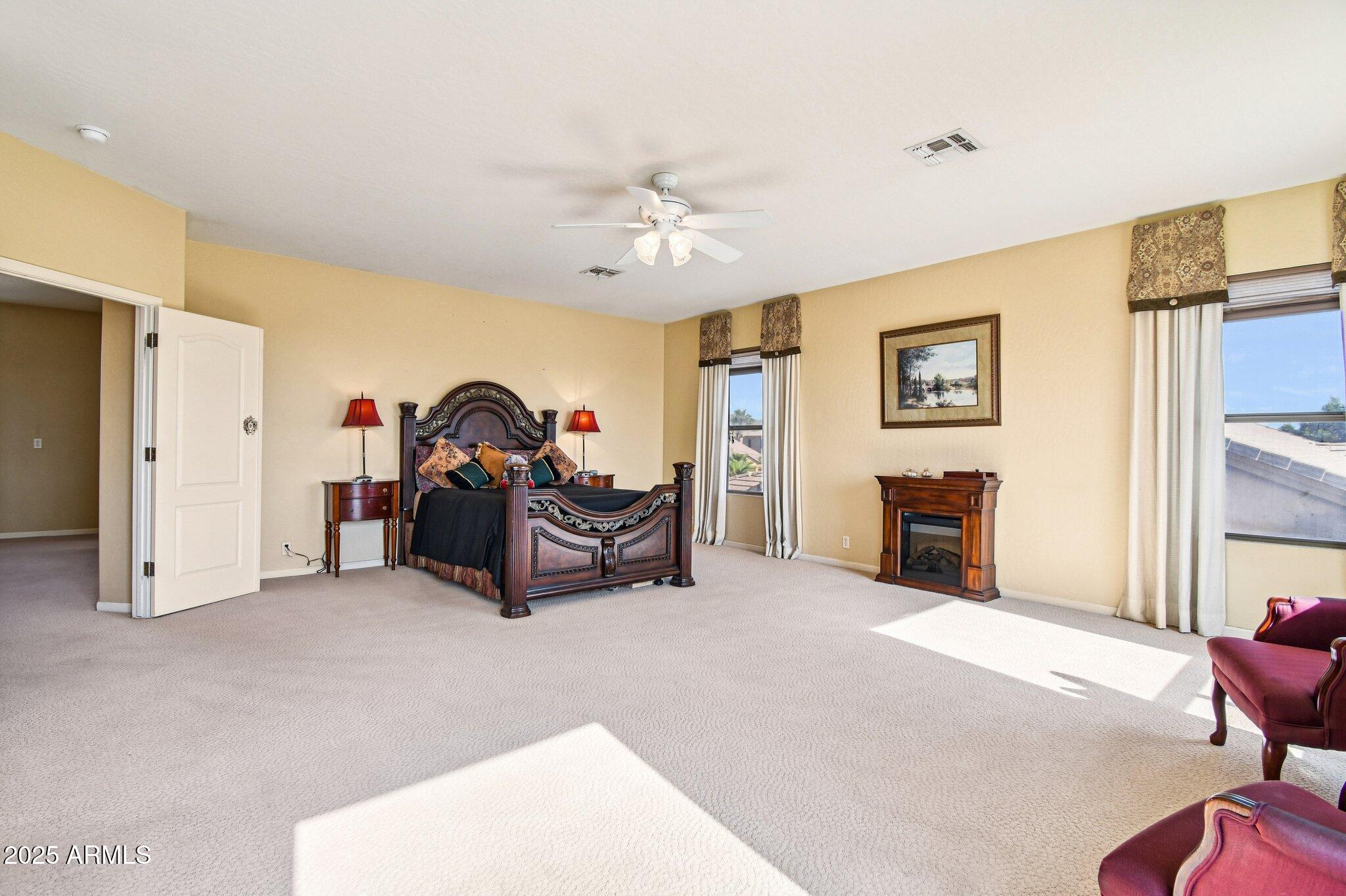 923 West Windsong Drive Phoenix, AZ 85045 - Photo 23 of 57 a living room with furniture a ceiling fan and a window