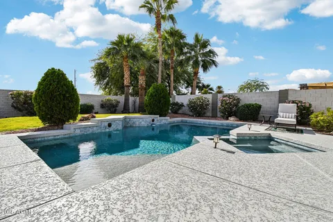 a view of a swimming pool and lounge chair