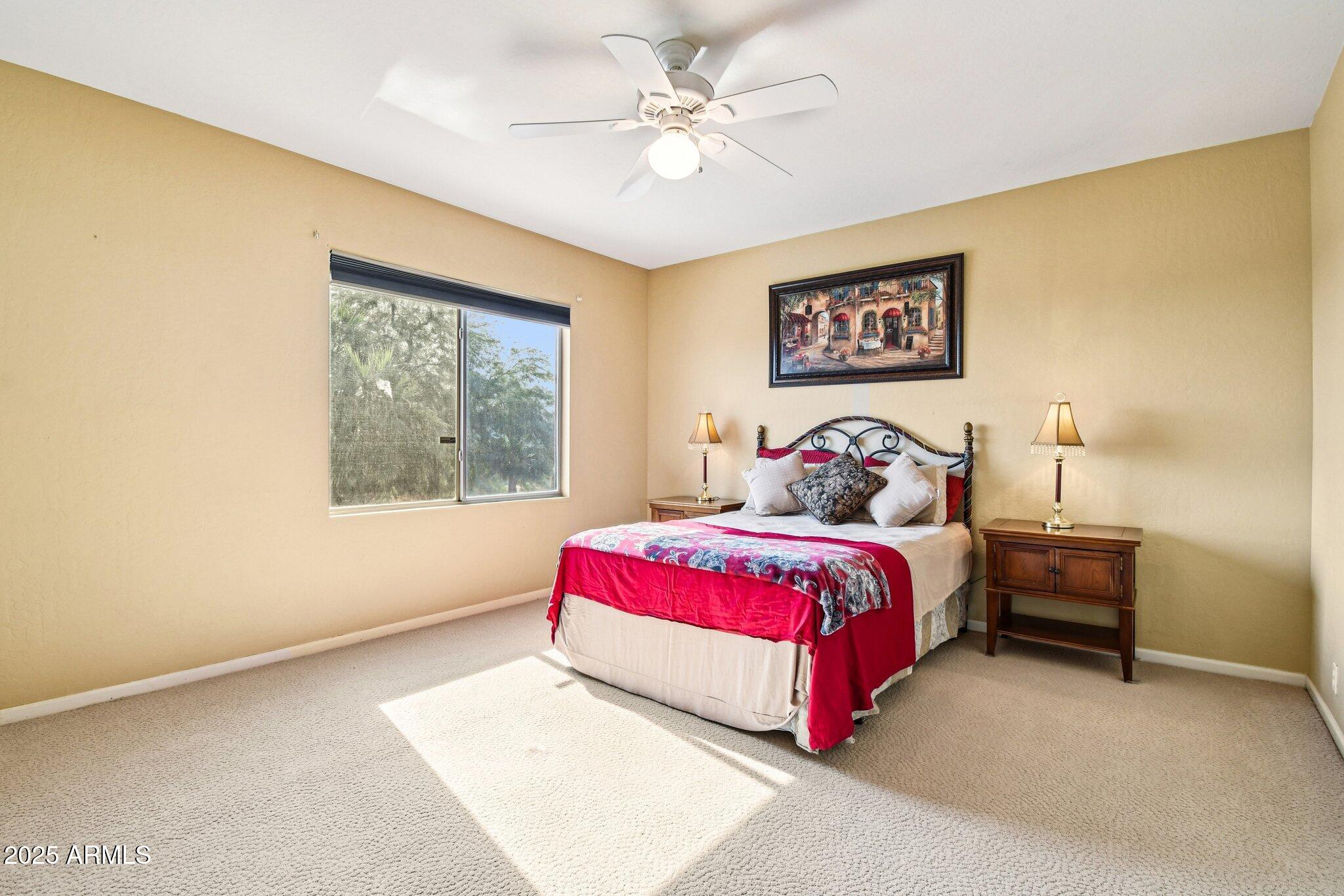 923 West Windsong Drive Phoenix, AZ 85045 - Photo 32 of 57 a bedroom with a bed and a window