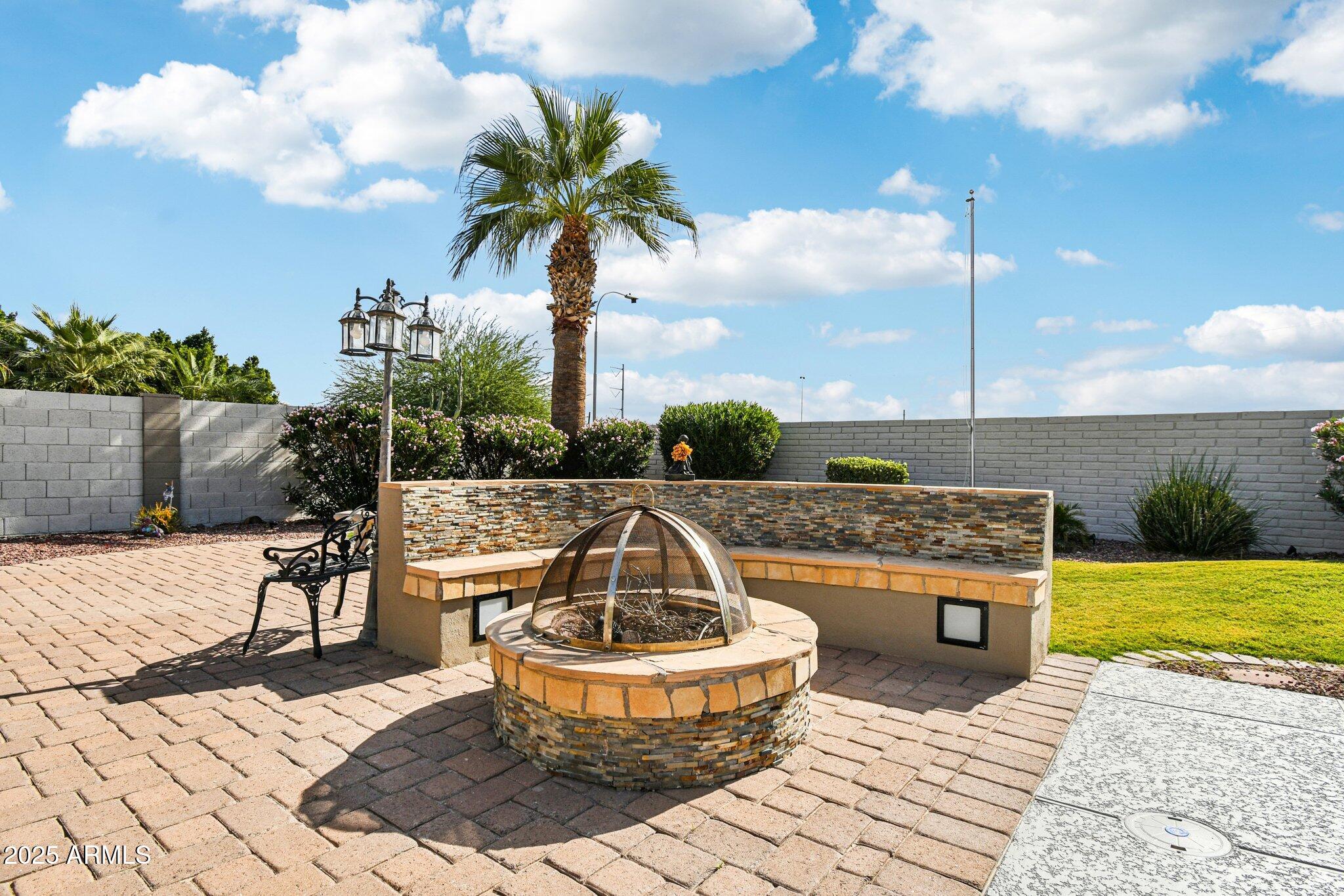 923 West Windsong Drive Phoenix, AZ 85045 - Photo 36 of 57 Built in seating and firepit