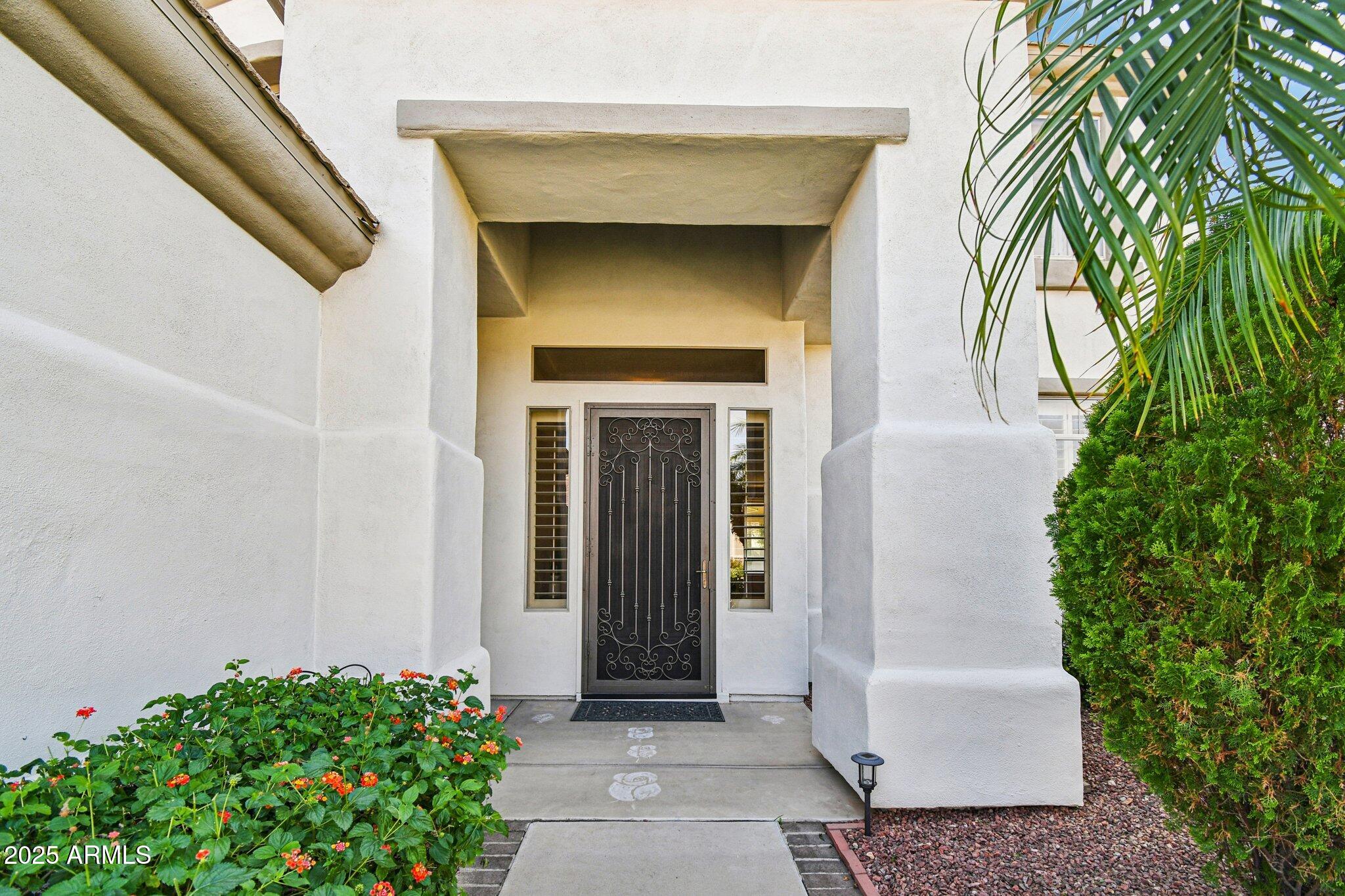 923 West Windsong Drive Phoenix, AZ 85045 - Photo 49 of 57 a front view of a house with a garden