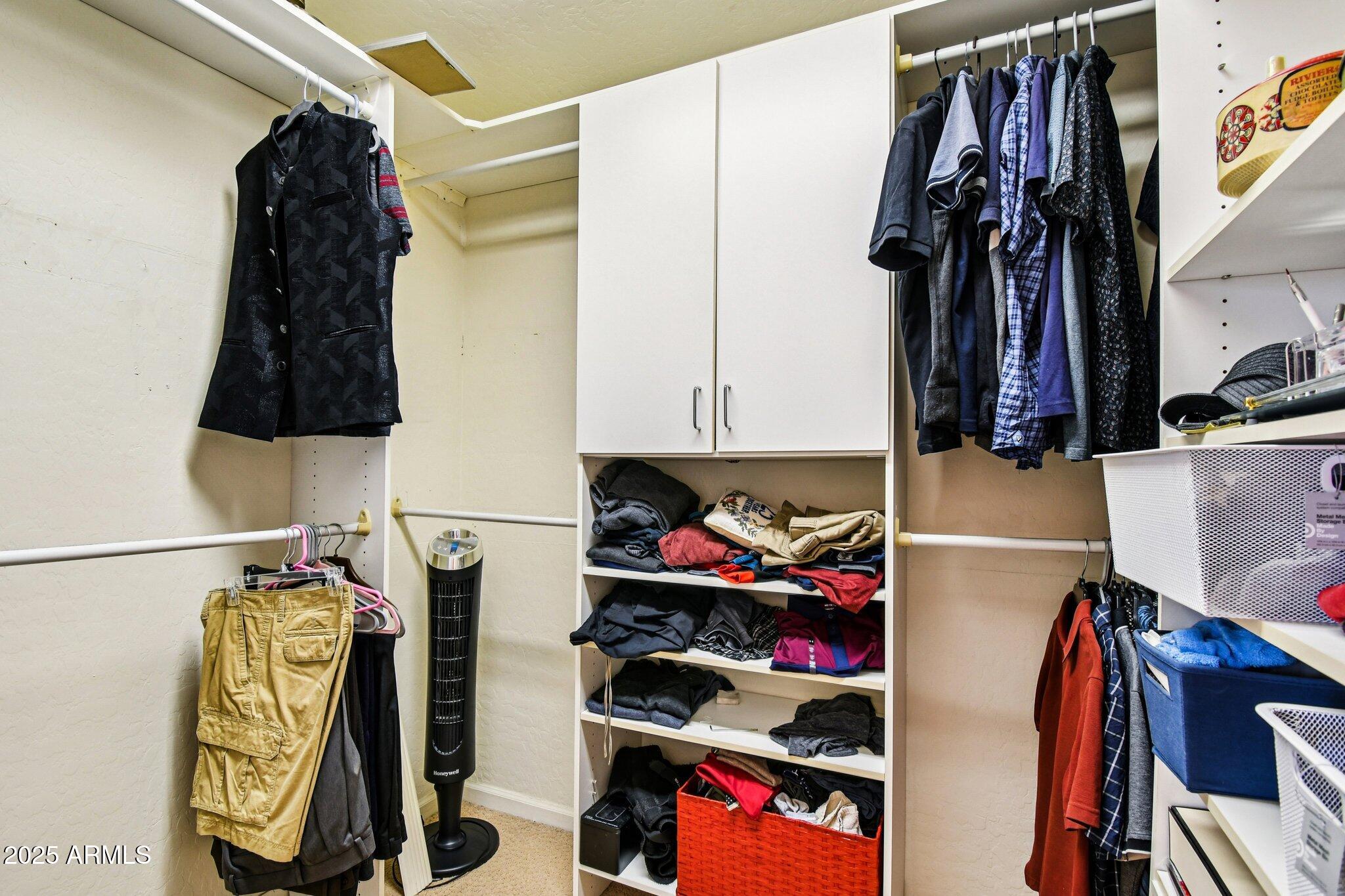 923 West Windsong Drive Phoenix, AZ 85045 - Photo 51 of 57 a view of walk in closet with clothes and shoes