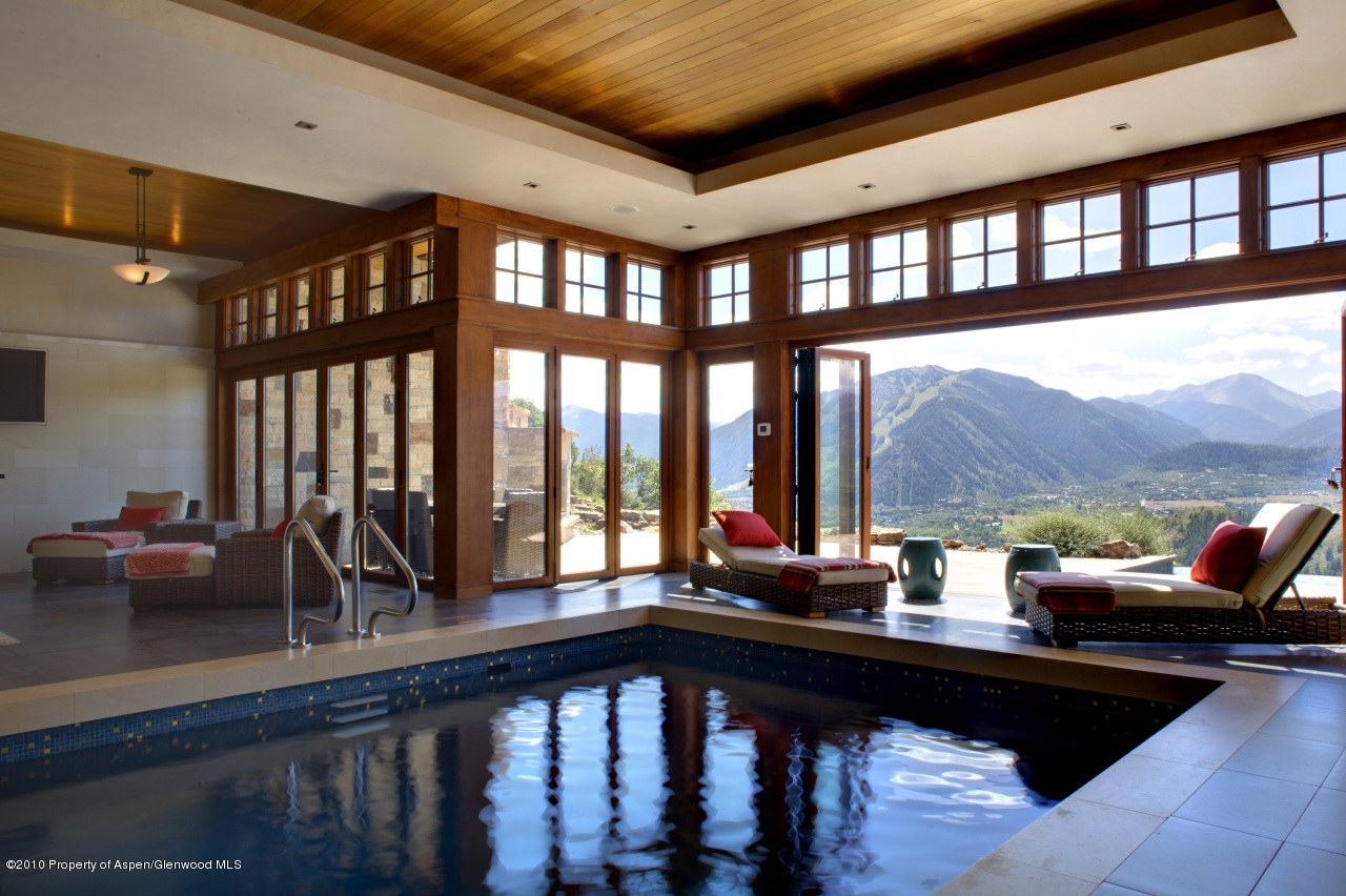 570 Eppley Drive Aspen, CO 81612 - Photo 18 of 23 a living room with furniture tv and a large window