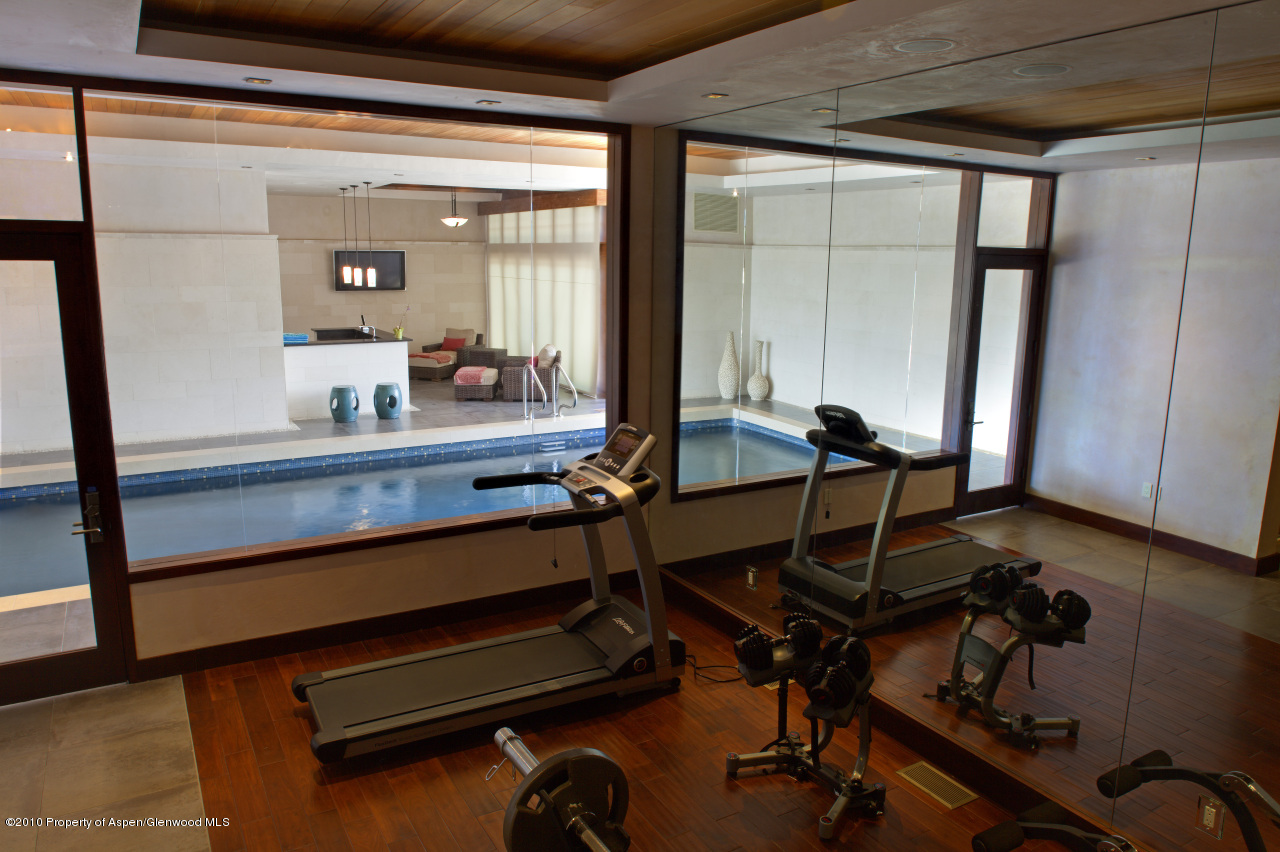 570 Eppley Drive Aspen, CO 81612 - Photo 20 of 23 a room with gym equipment and large mirror