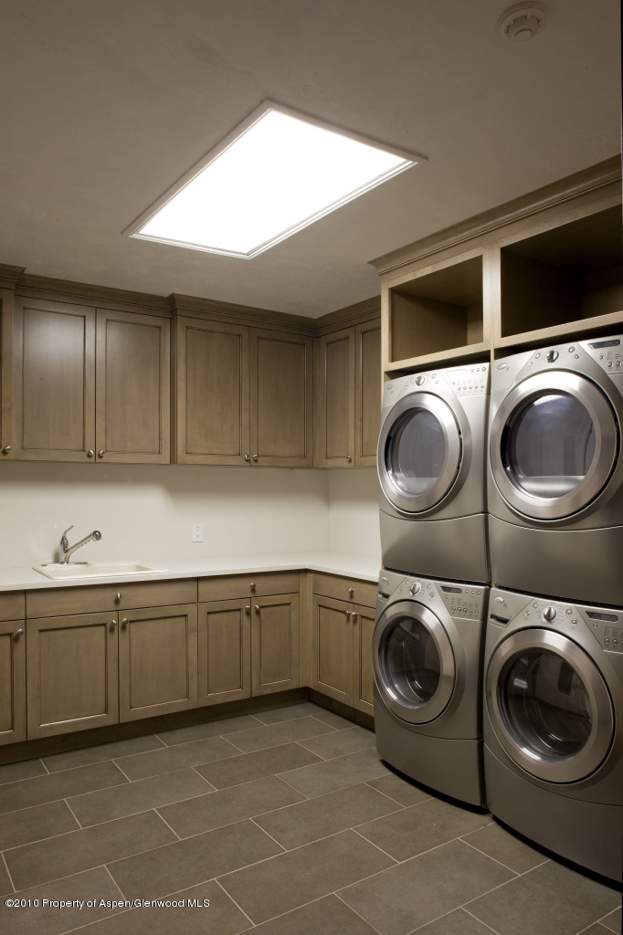 570 Eppley Drive Aspen, CO 81612 - Photo 23 of 23 a utility room with sink dryer and washer