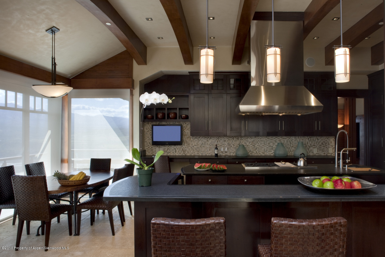 570 Eppley Drive Aspen, CO 81612 - Photo 8 of 23 a kitchen with a table and chairs