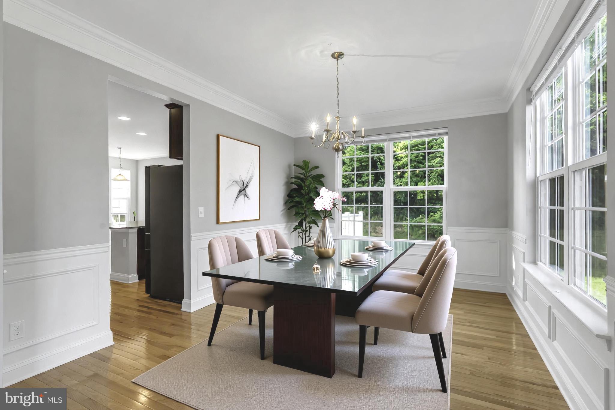 40560 Aldie Springs Drive Aldie, VA 20105 - Photo 15 of 68 a view of a dining room with furniture window and wooden floor