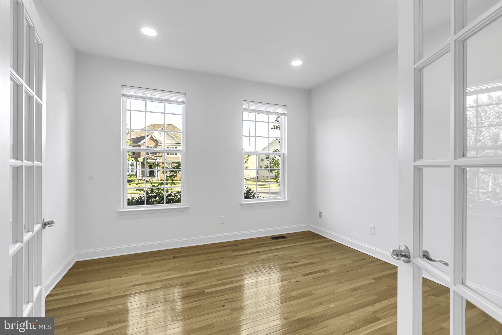 40560 Aldie Springs Drive Aldie, VA 20105 - Photo 19 of 68 a view of empty room with wooden floor and fan