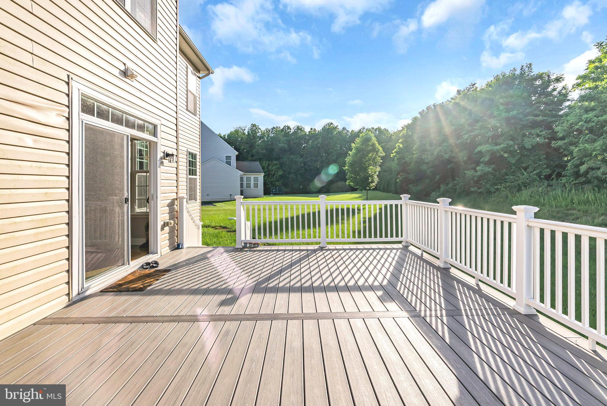 40560 Aldie Springs Drive Aldie, VA 20105 - Photo 25 of 68 a view of a wooden deck with a yard