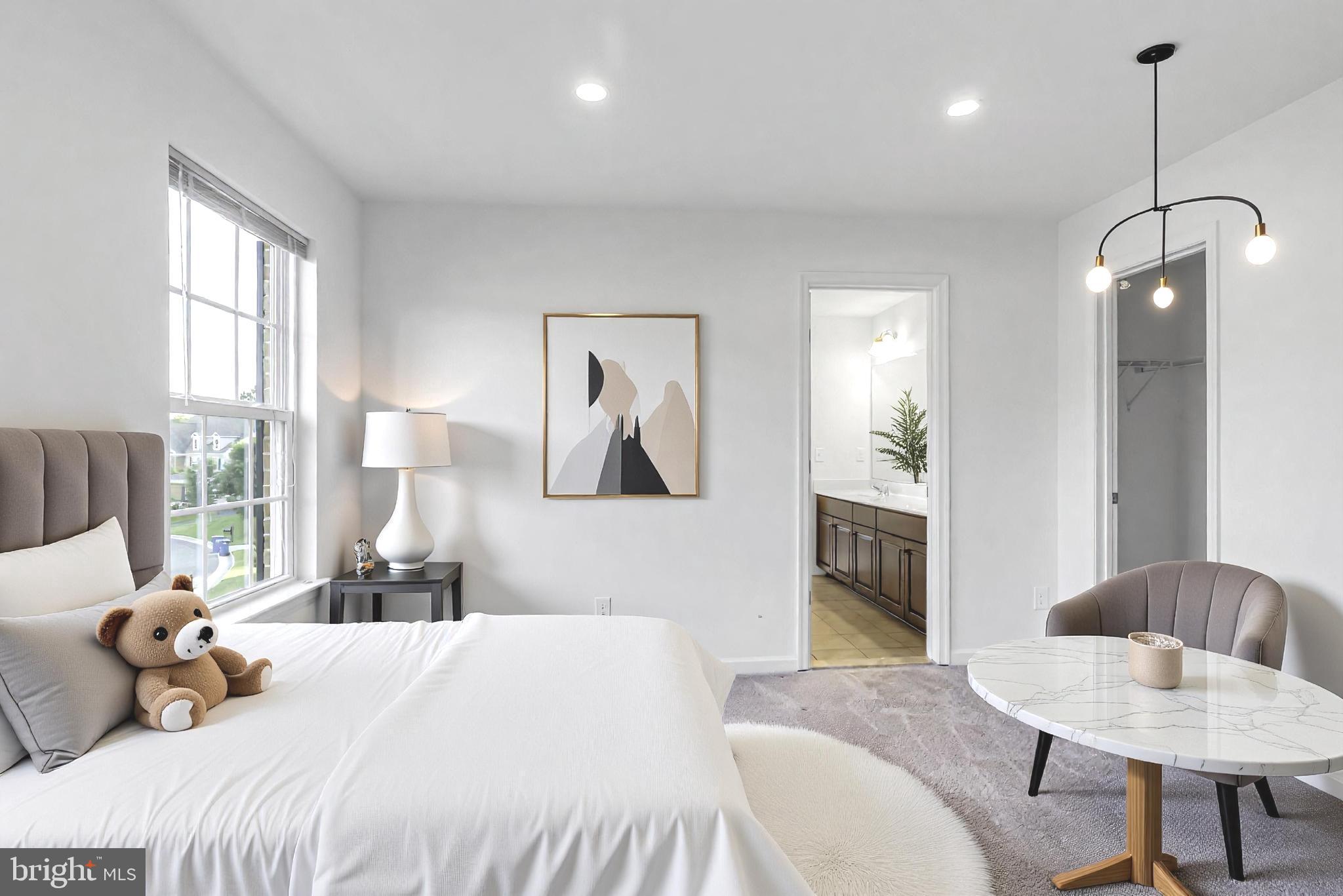 40560 Aldie Springs Drive Aldie, VA 20105 - Photo 42 of 68 a bedroom with a bed and a couch