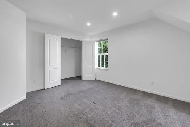 a kitchen with a white cabinets and white appliances