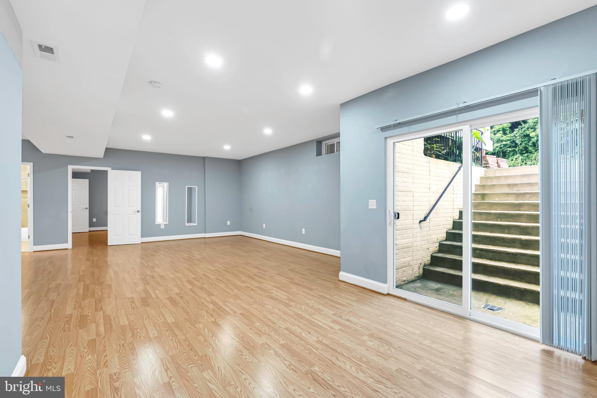 40560 Aldie Springs Drive Aldie, VA 20105 - Photo 54 of 68 a view of an empty room with wooden floor and a window