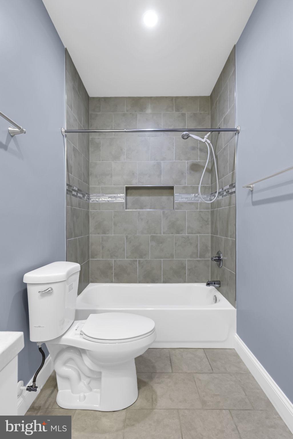 40560 Aldie Springs Drive Aldie, VA 20105 - Photo 58 of 68 a white toilet sitting next to a bath tub and a shower