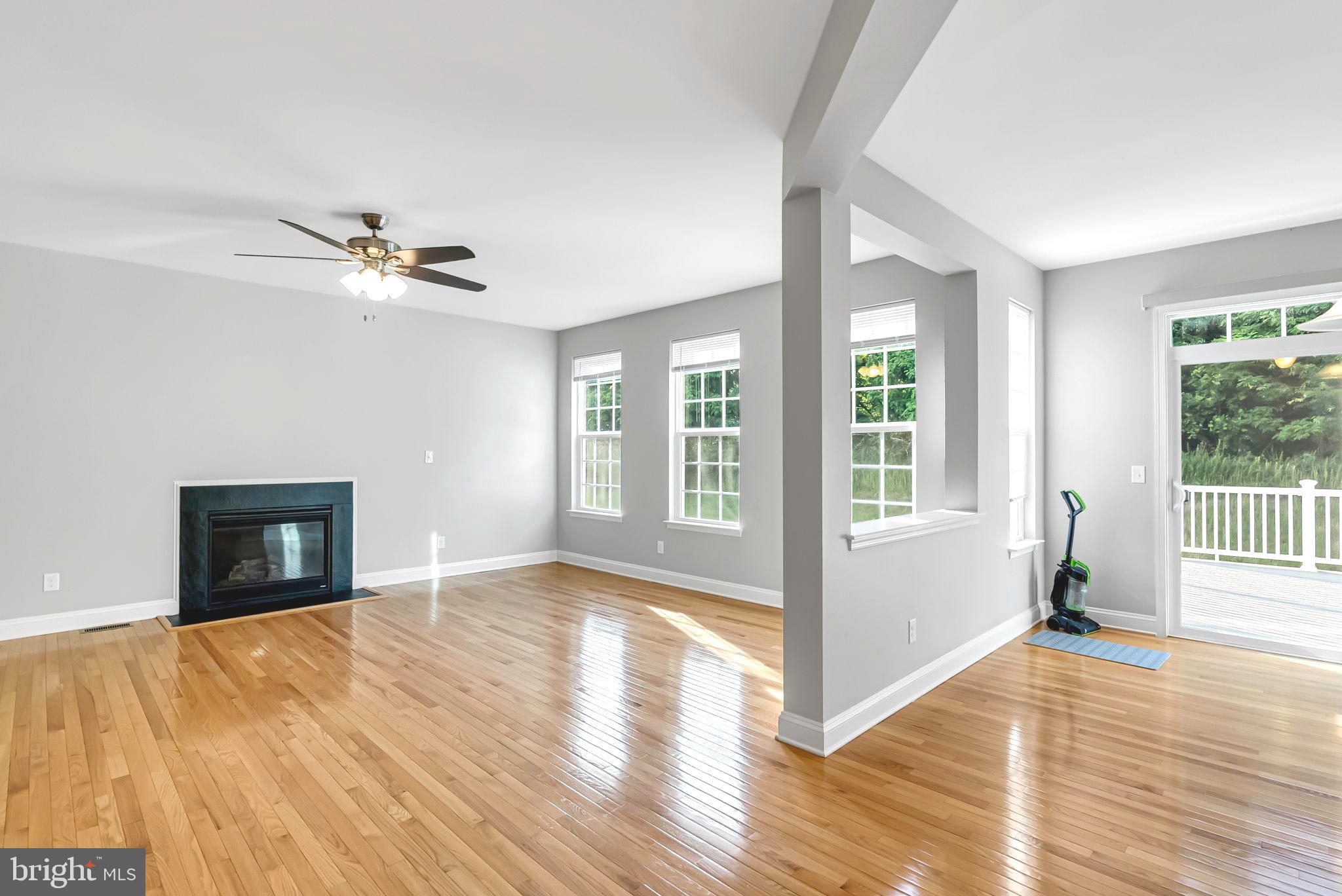 40560 Aldie Springs Drive Aldie, VA 20105 - Photo 10 of 68 a view of an empty room with window and wooden floor