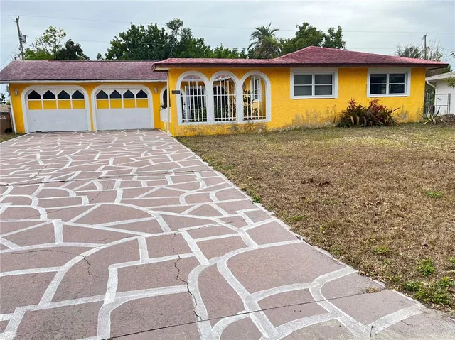 a view of a house with a wooden fence