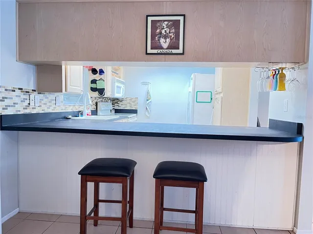 a spacious bedroom with a bed and a couch