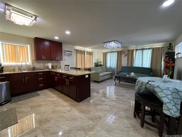 a kitchen with a cabinets and chairs