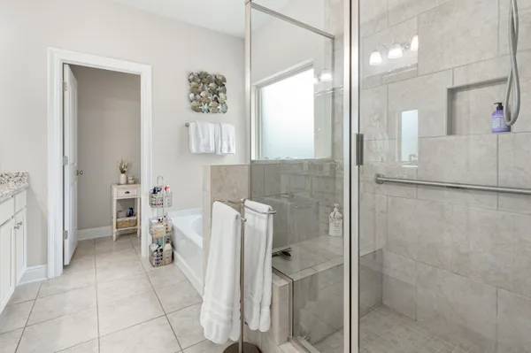 a bathroom with a bathtub and a shower