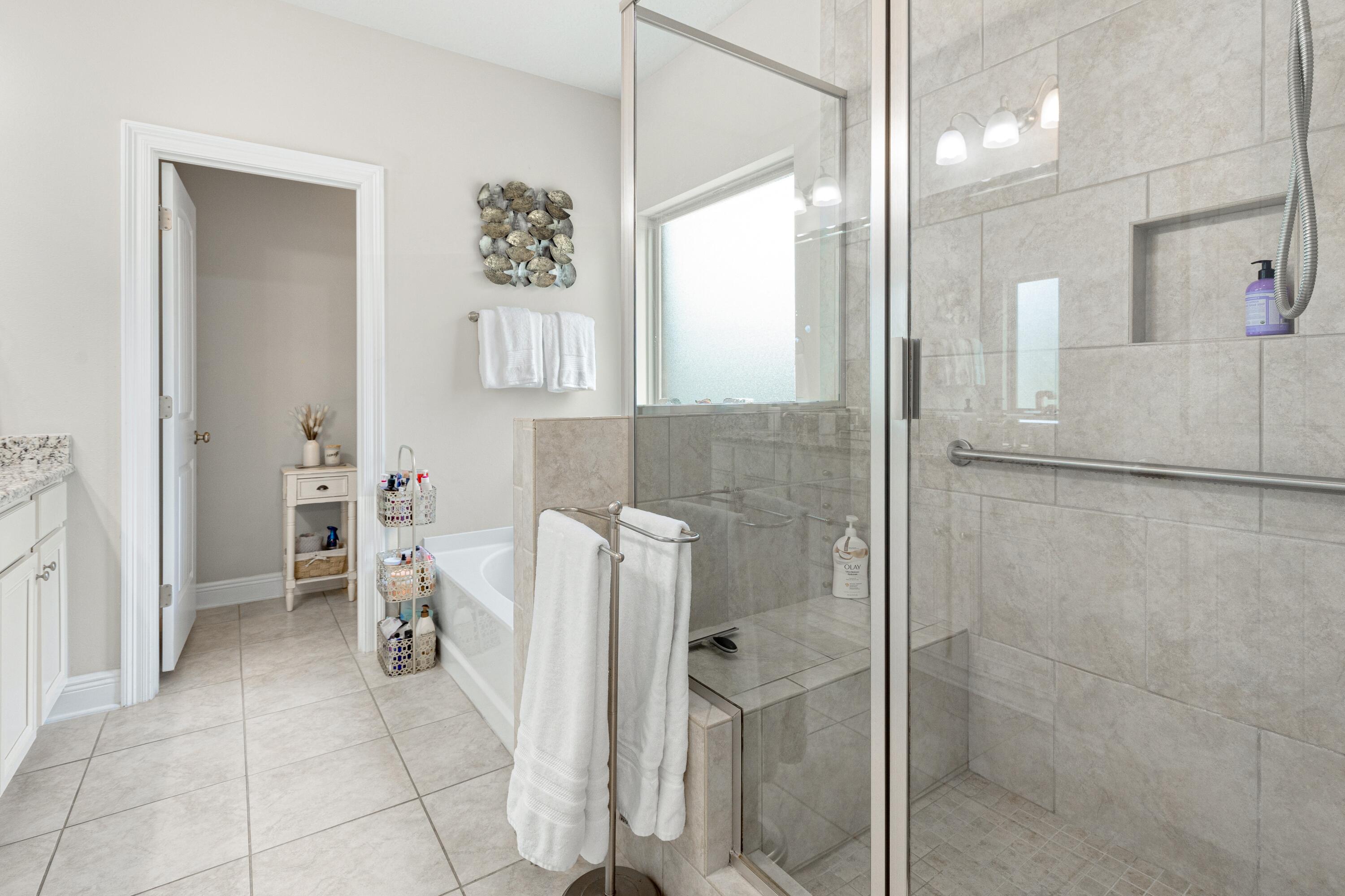 114 Maddox Street Santa Rosa Beach, FL 32459 - Photo 17 of 31 a bathroom with a bathtub and a shower