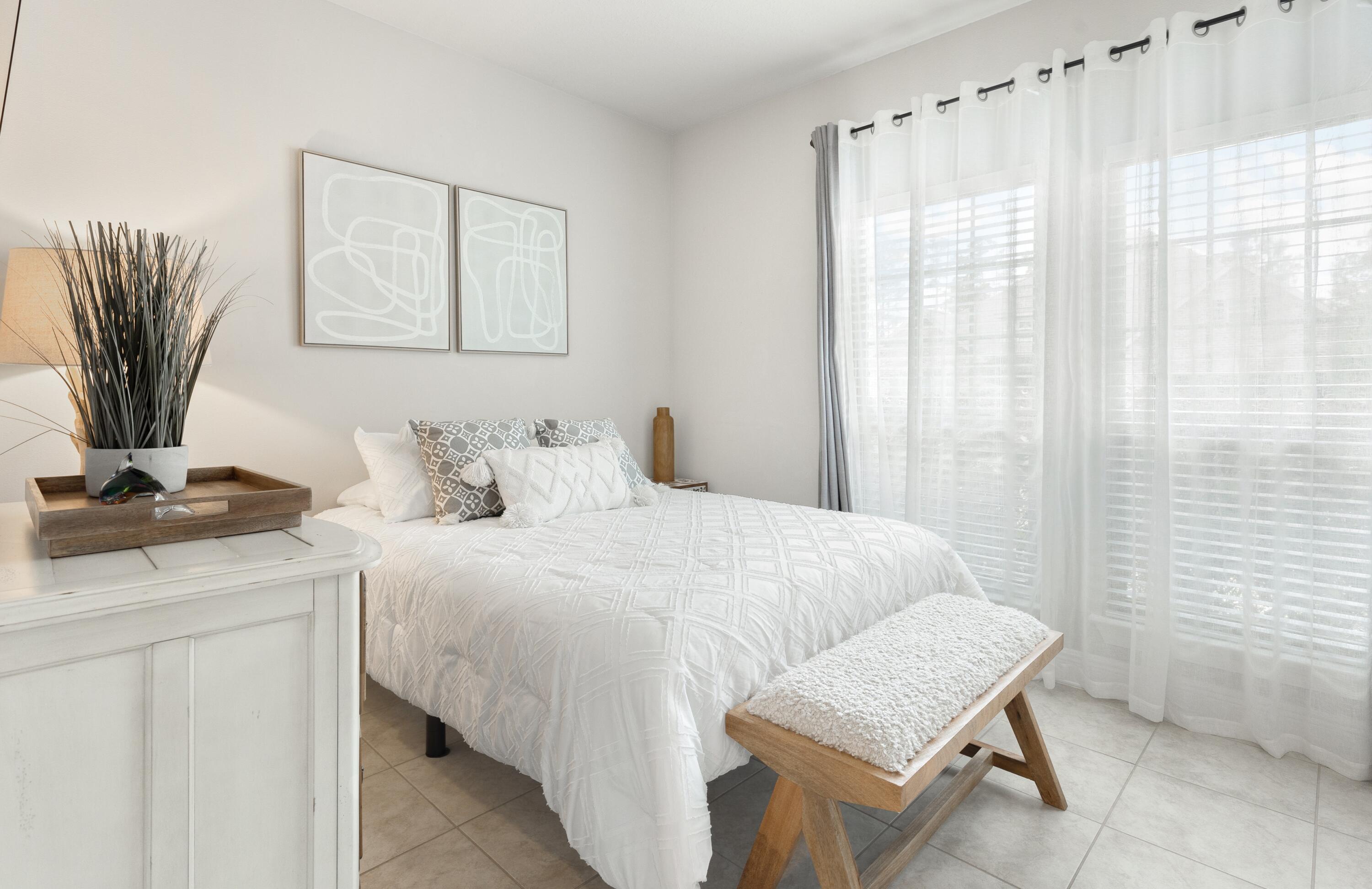 114 Maddox Street Santa Rosa Beach, FL 32459 - Photo 19 of 31 a bedroom with a bed and a table in it