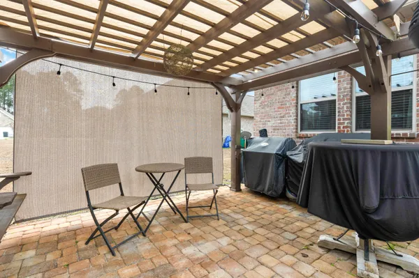 a view of a chairs and table in the patio