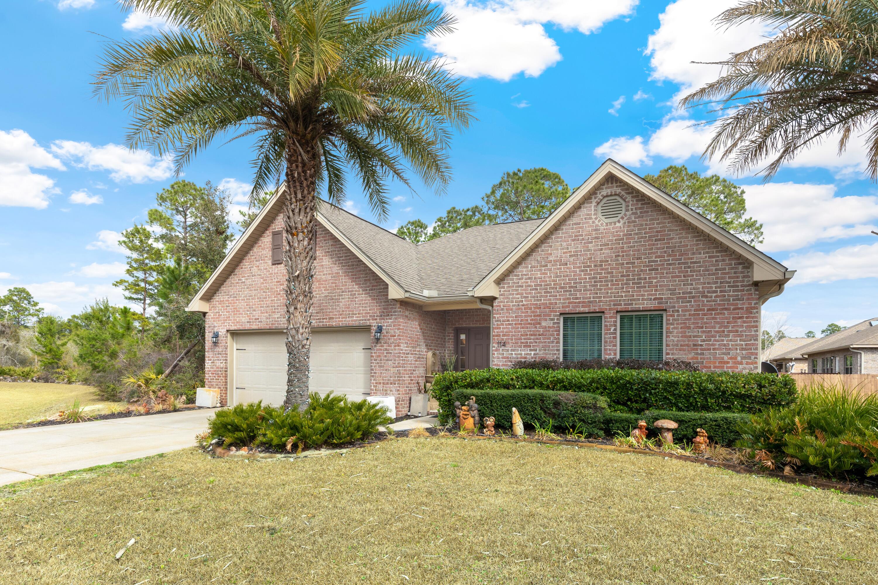 114 Maddox Street Santa Rosa Beach, FL 32459 - Photo 30 of 31 a view of a house with a patio